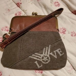 Small cluch with chin strap.